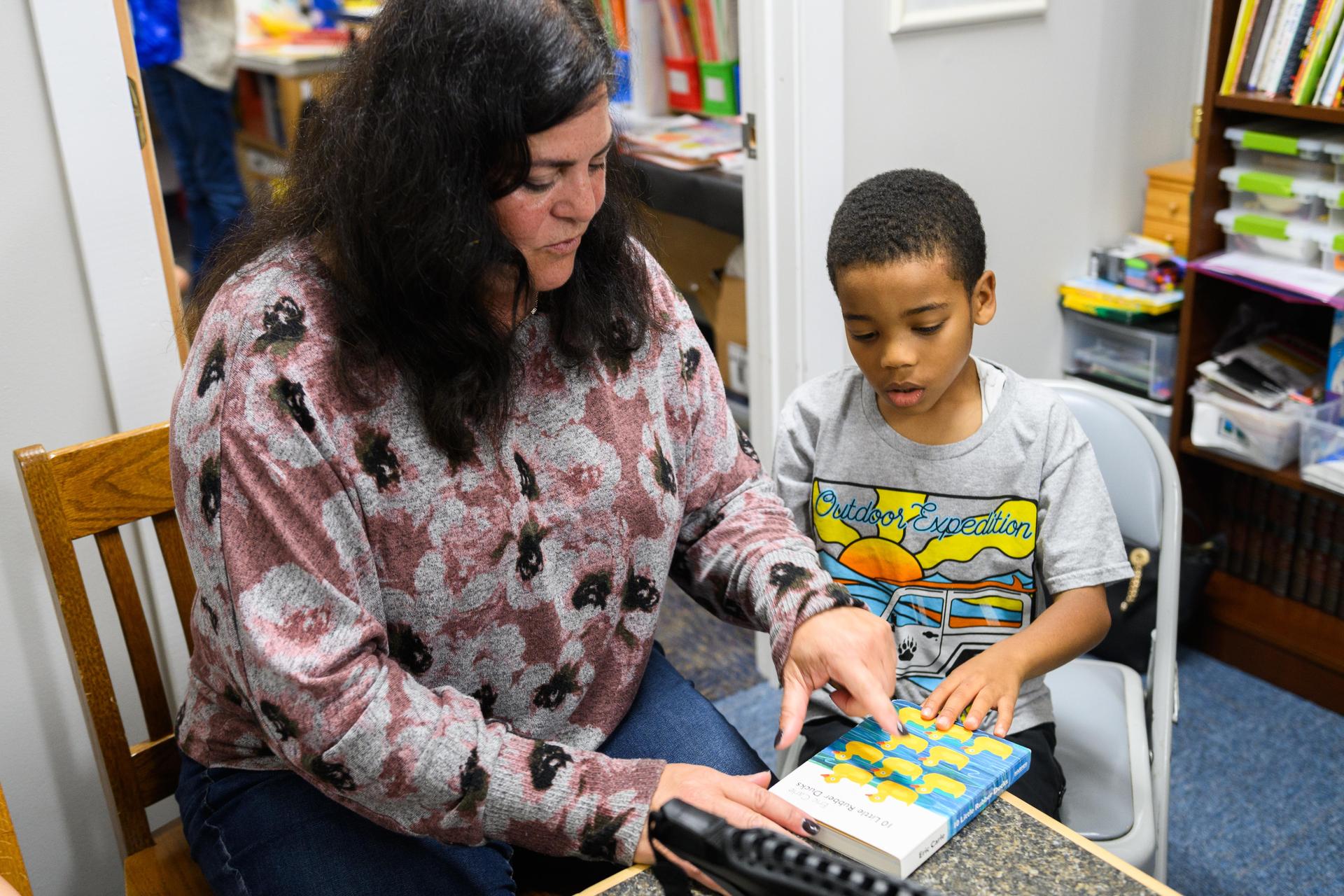 Teacher with student reading