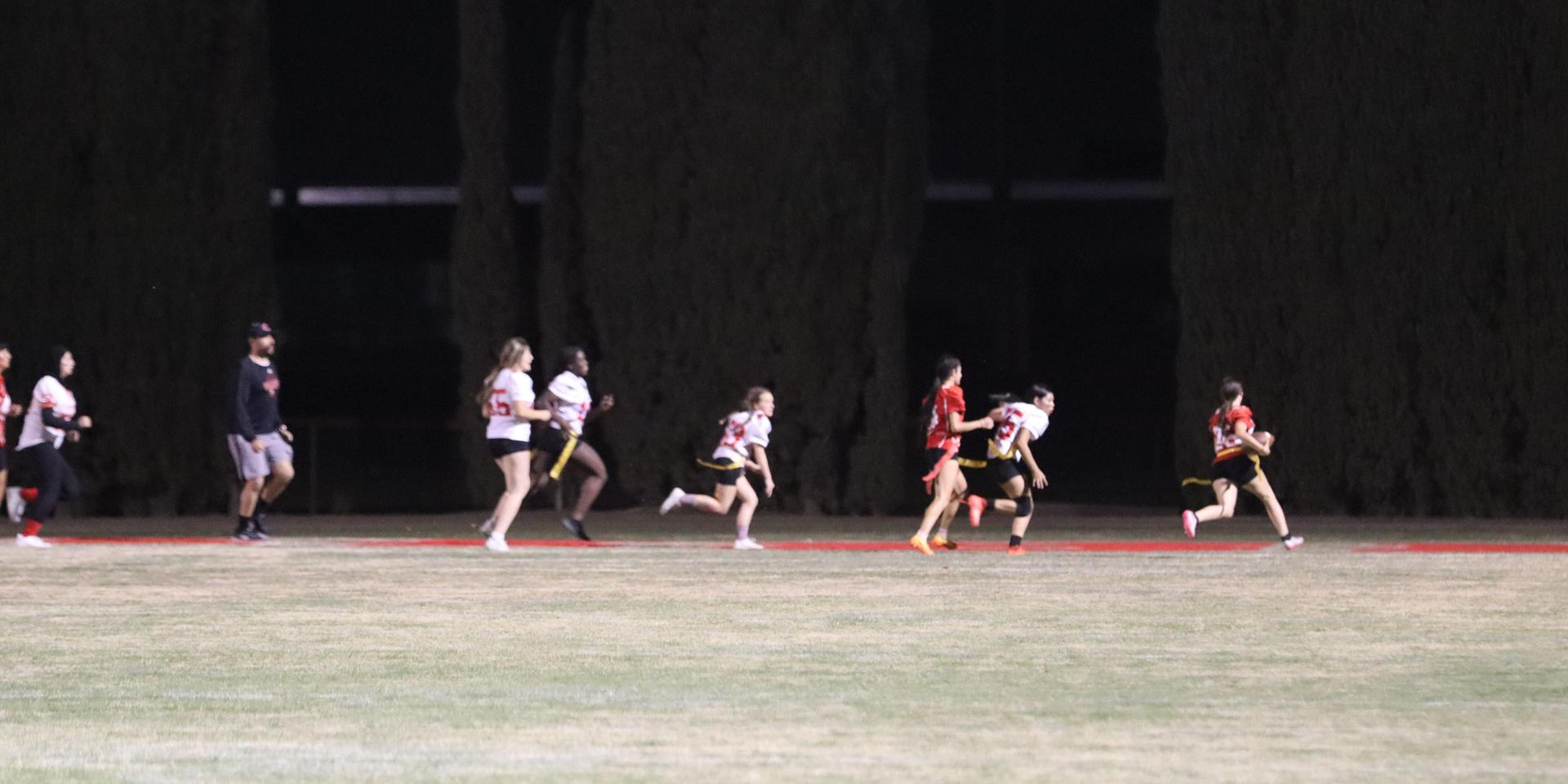 girls playing flag football