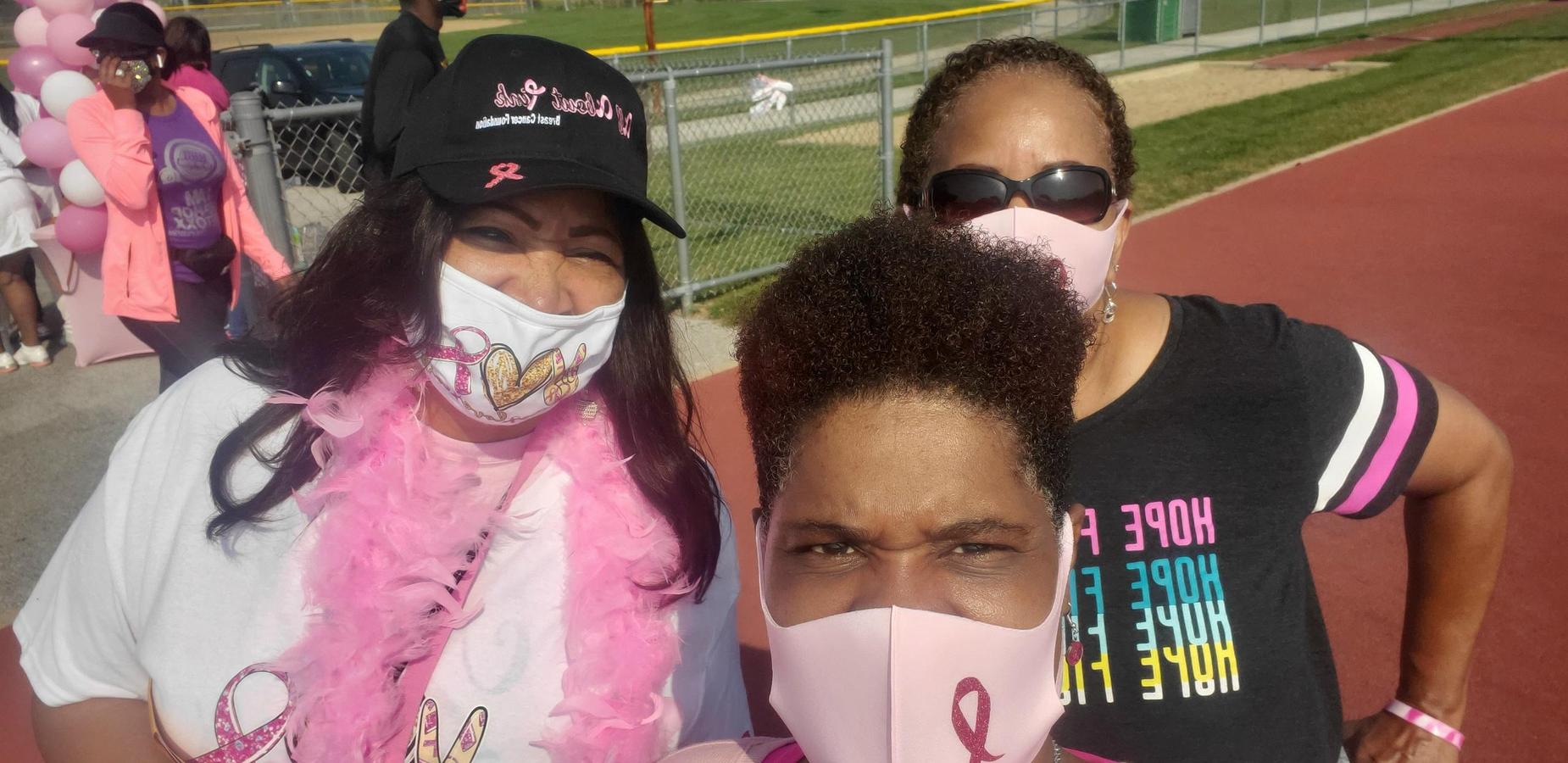 Celebrating Breast Cancer Awareness Month - 3 Women wearing shirts to support Breast Cancer Awareness and