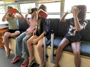 Children test out virtual reality goggles on Durango School District's new Ignite Mobile Learning Lab bus.
