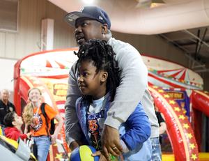 parent and child playing basketball