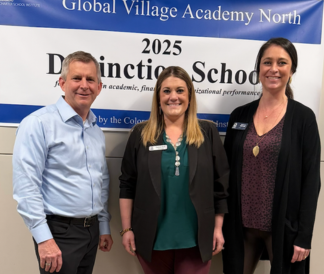 Jed Wallace Chelsea Byrd and Nicole Wetzel in front of GVA N Distinction banner