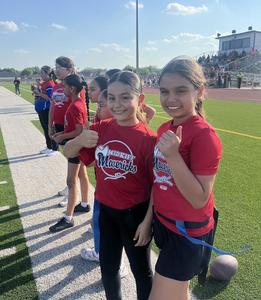 Midkiff students give a thumbs up at girls flag football game