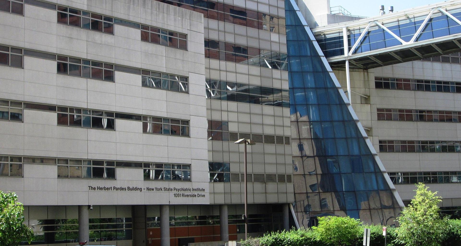 Modern building with glass and concrete design, labeled Herbert Pardes Building.