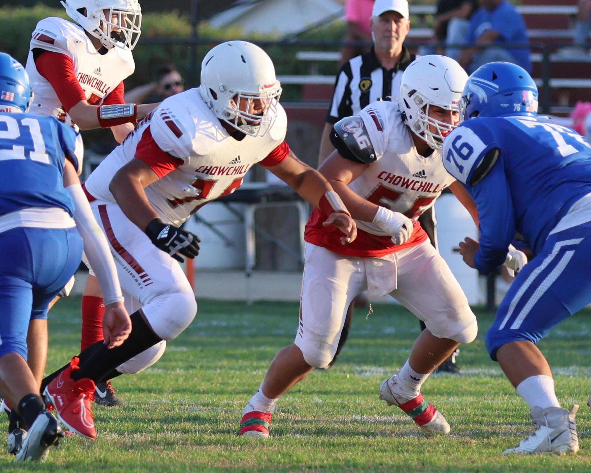 Junior Varsity football players in action against Caruthers