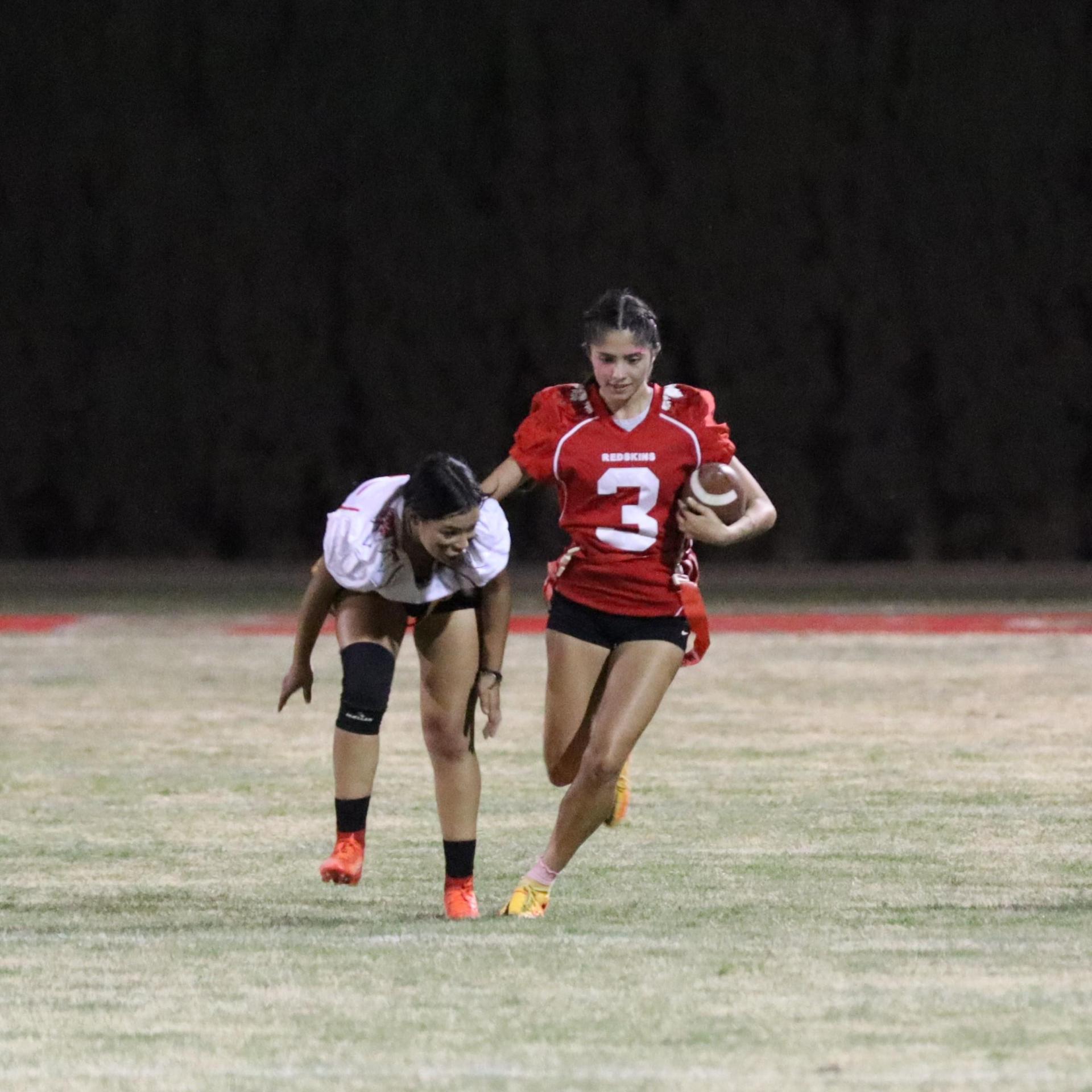 girls playing flag football
