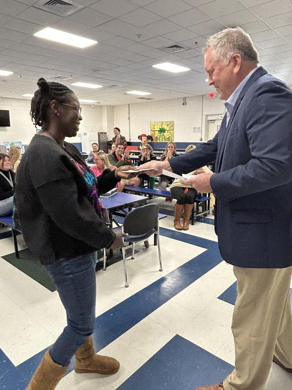 Rice Teachers Receive Checks from State Department