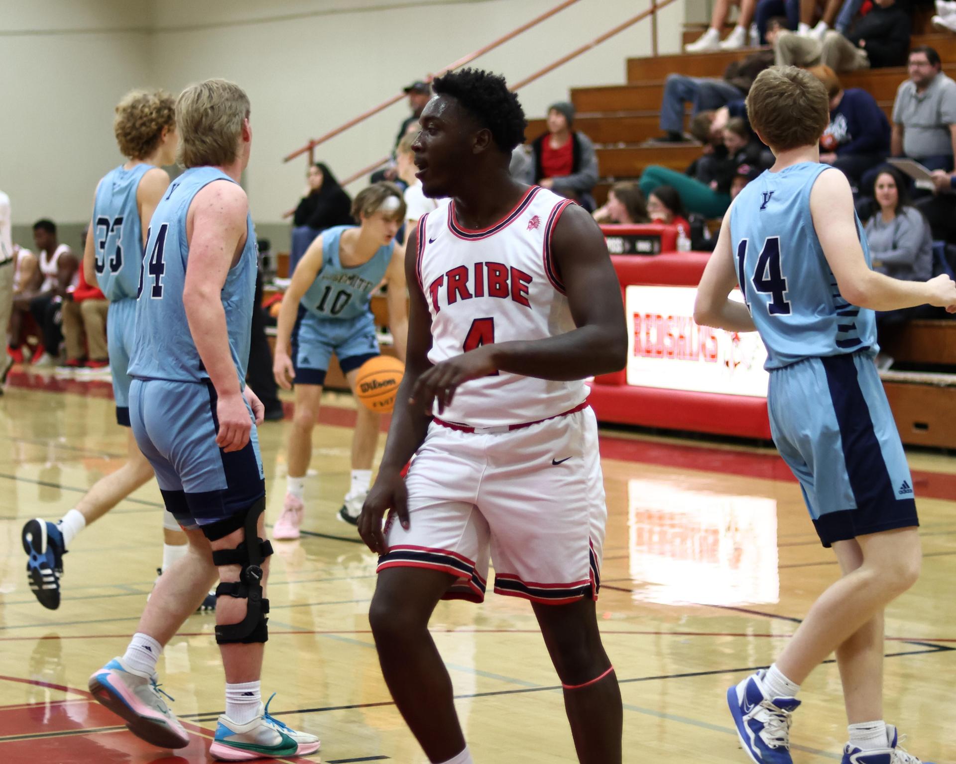 Varsity boys playing basketball against yosemite