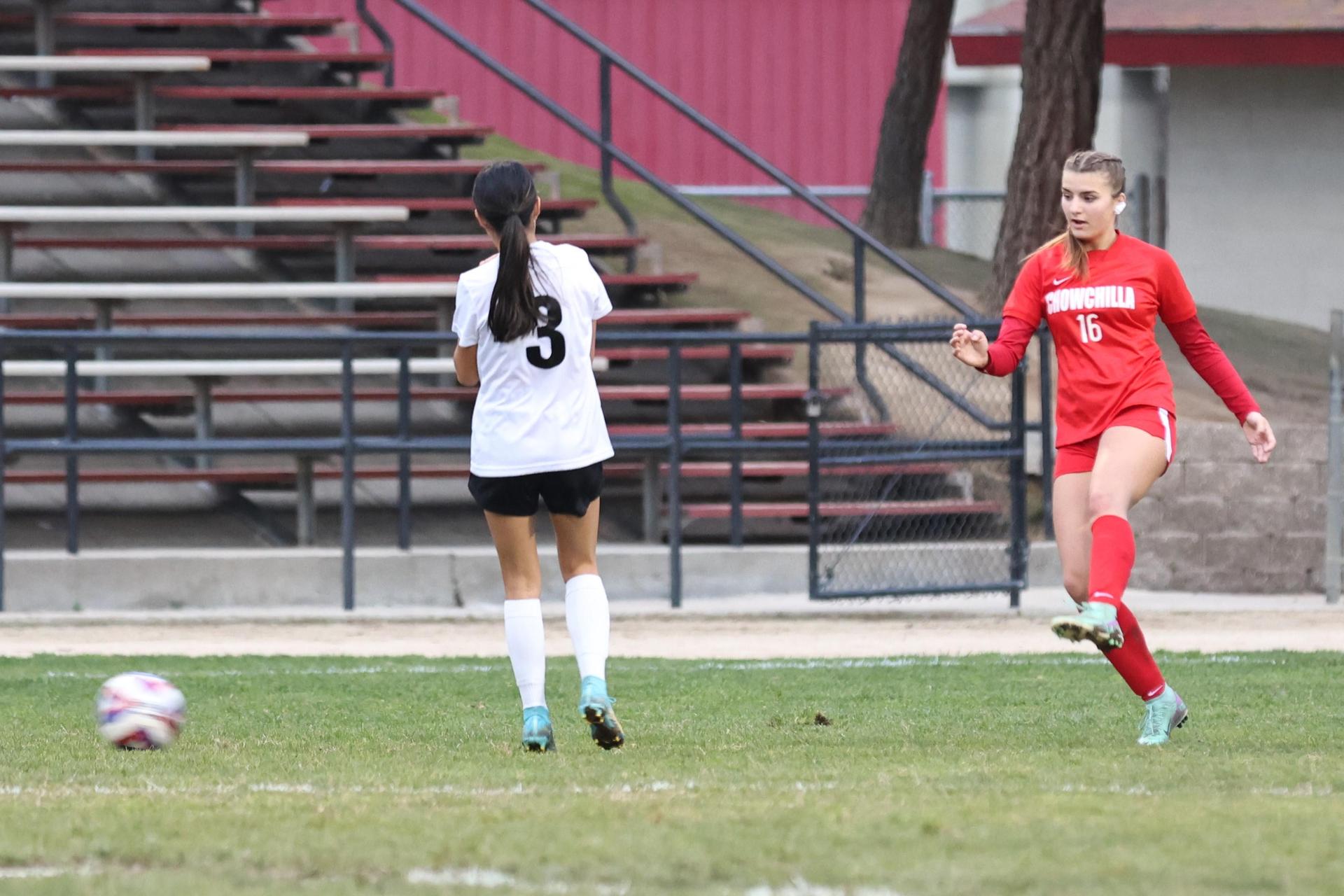 Junior varsity girls playing soccer against liberty