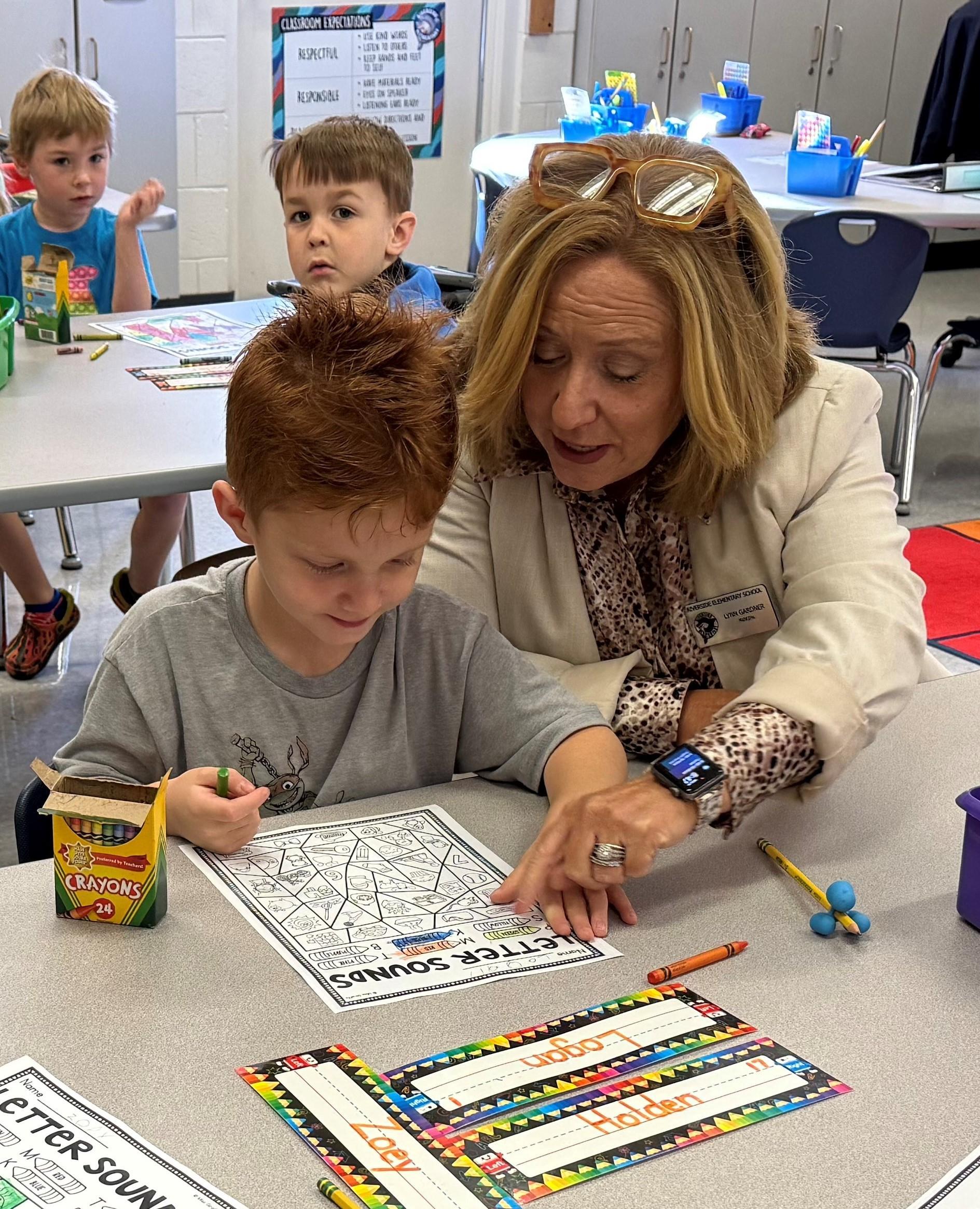Image of Mrs. Gardner working with a student