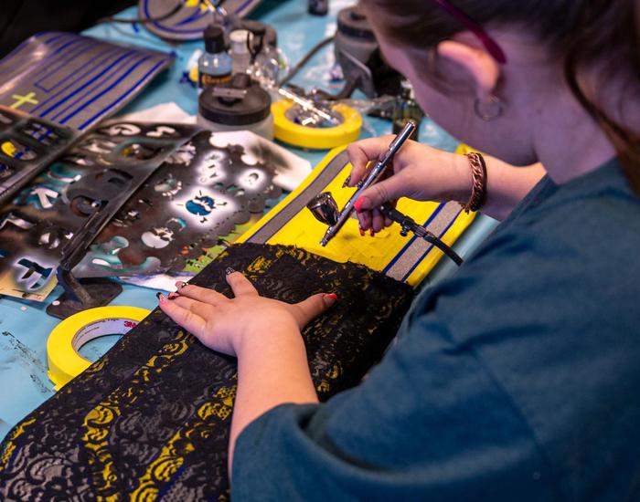 Students design and airbrush skateboards