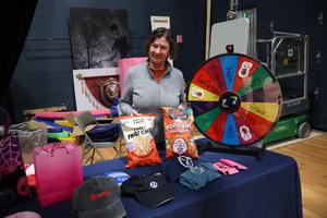 School representative displays raffle prizes at Tradeswomen of Tomorrow forum
