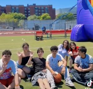 a photo of some seniors from the event at the field