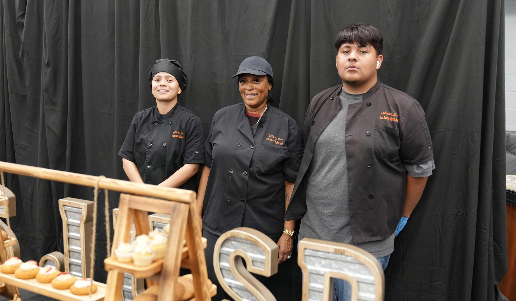 Culinary students and teacher at State of the District event