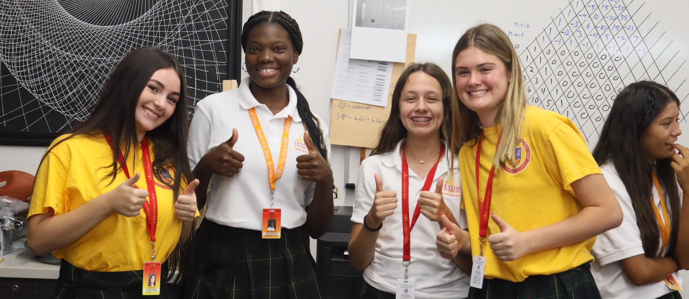 girls doing a thumbs up