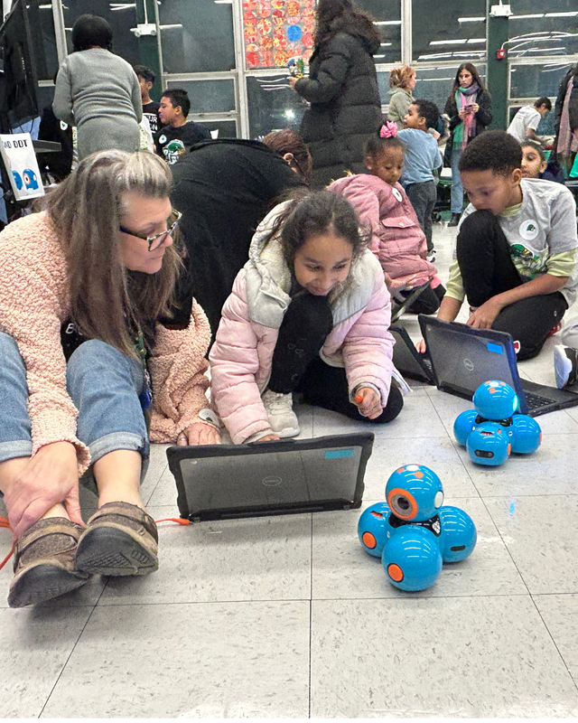 Adults and children program robots