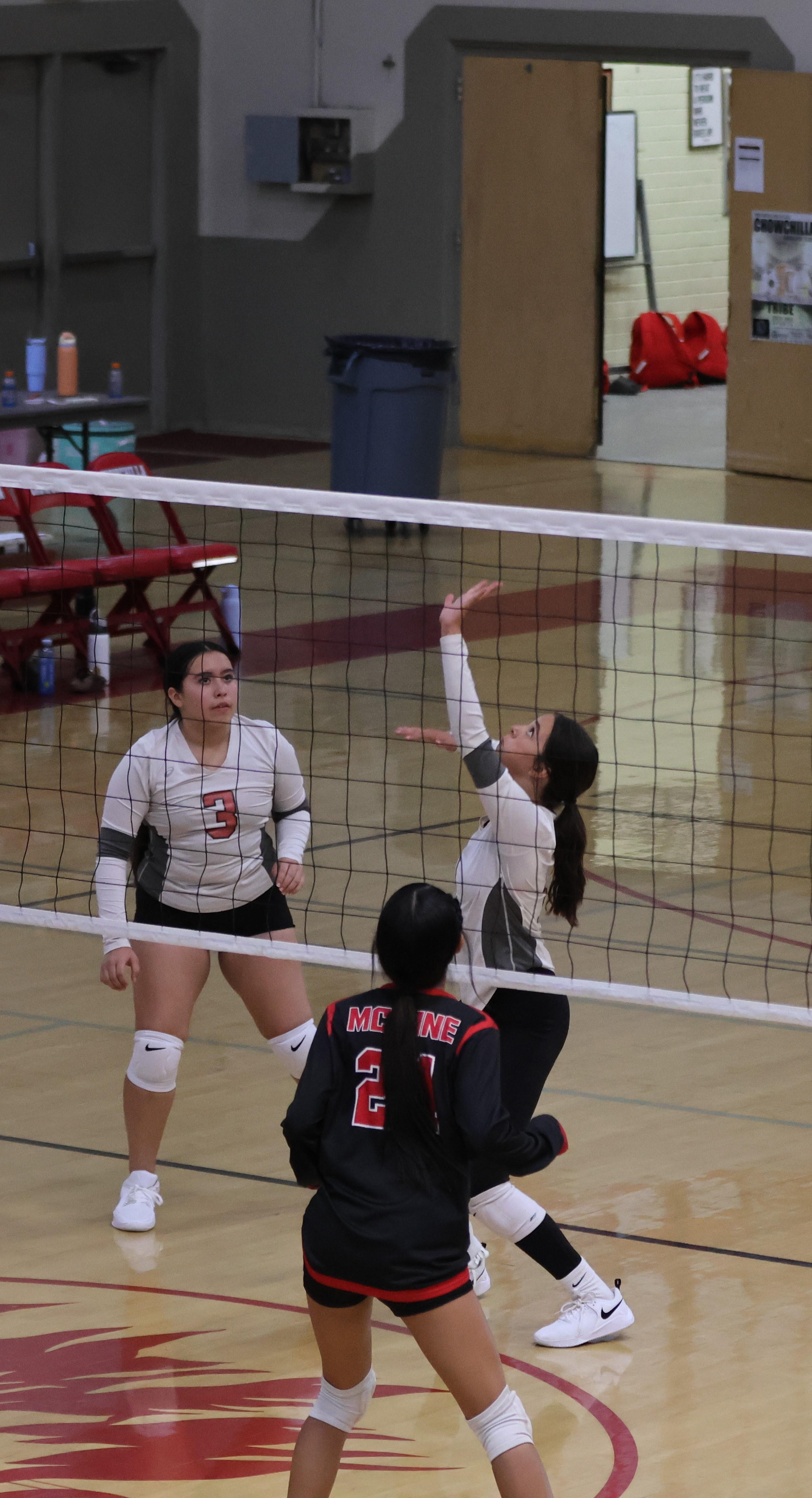 junior varsity girls playing volleyball 116
