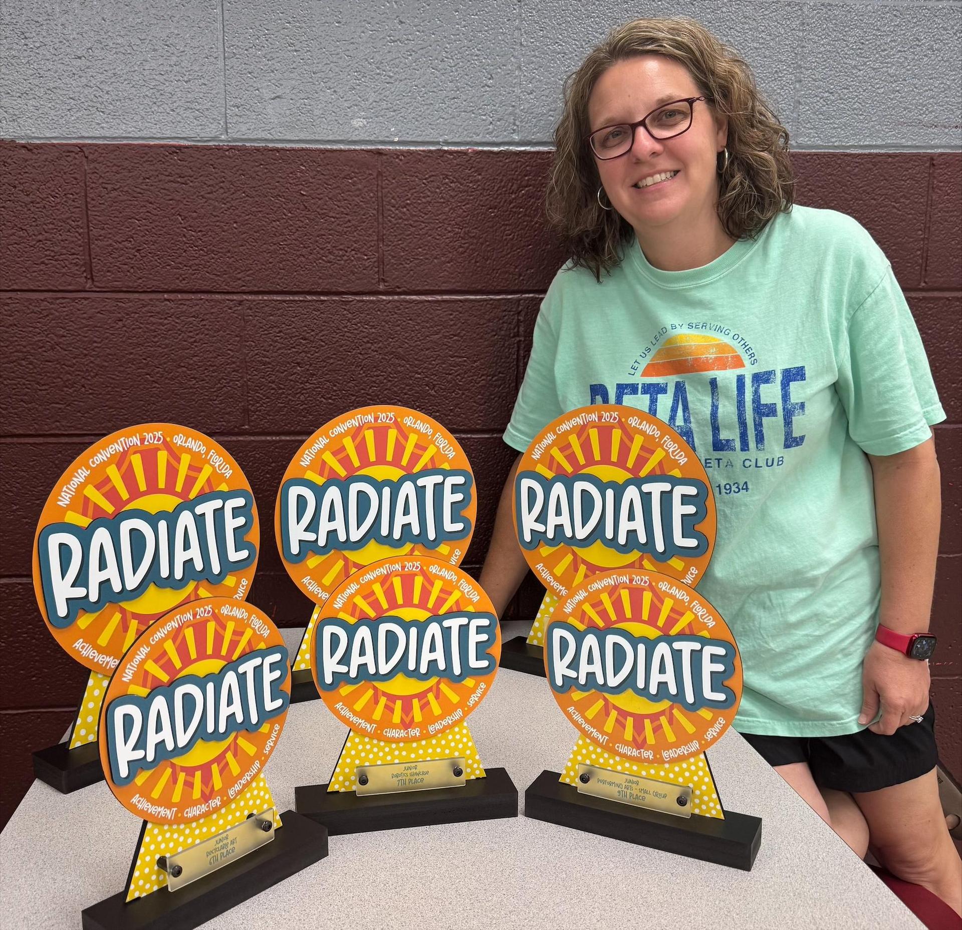 Woman with six Radiate trophies. 
