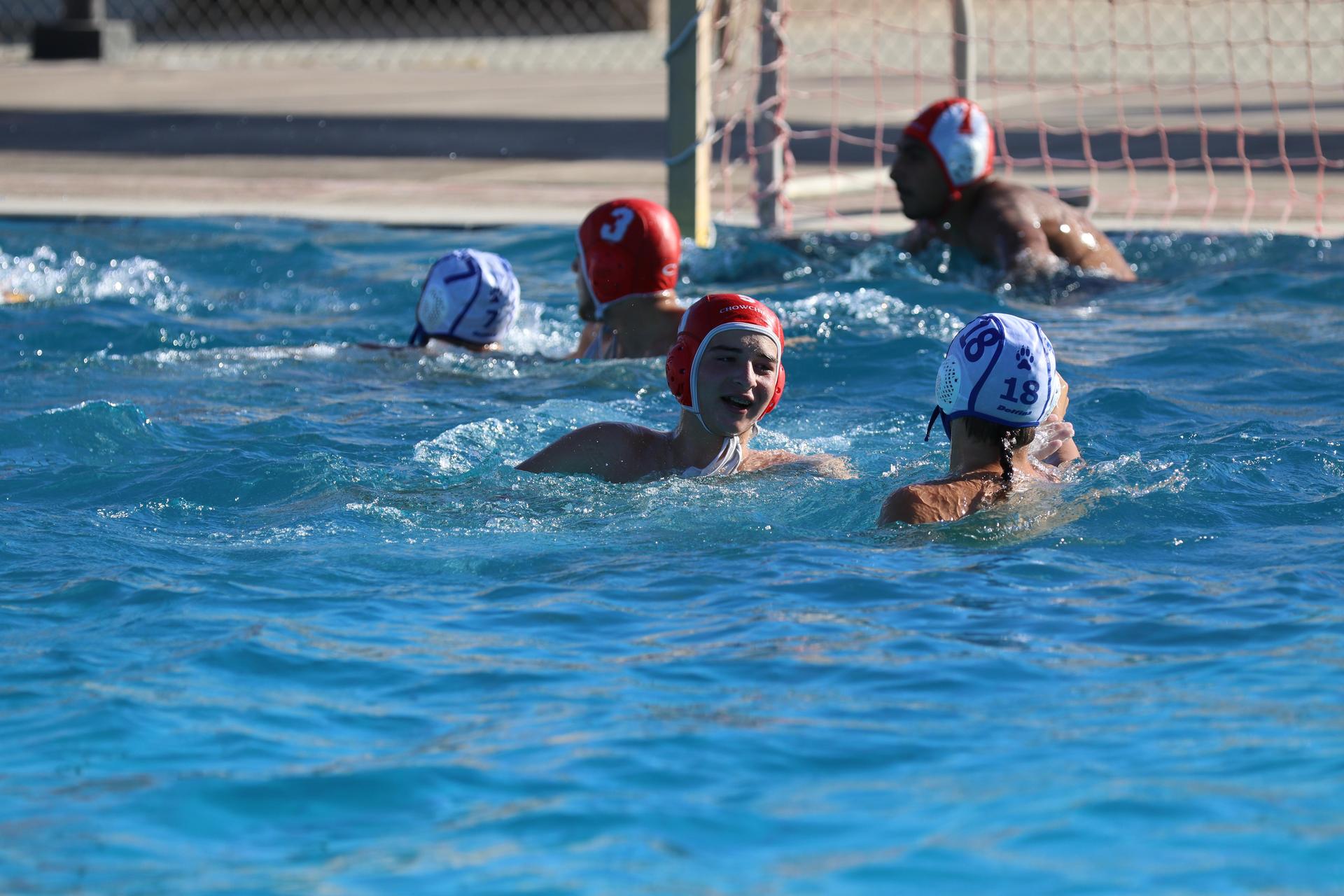 boys playing water polo against Madera