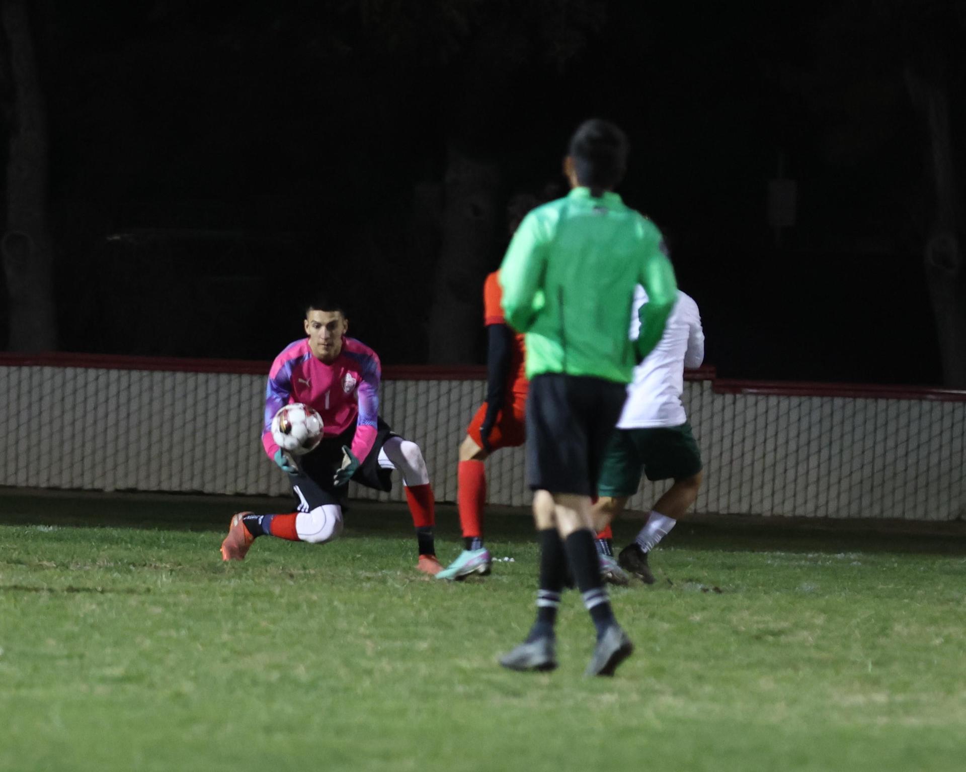 Varsity boys play soccer against Kingsburg
