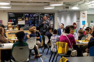 Mike Logan speaks with students