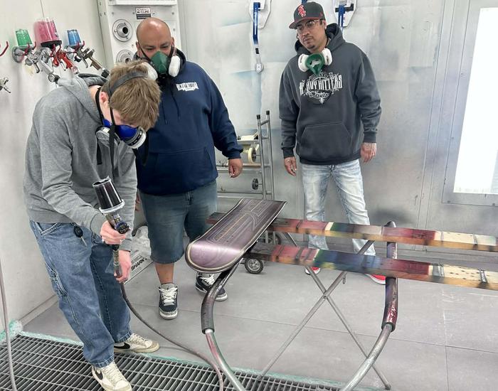 Students design and airbrush skateboards
