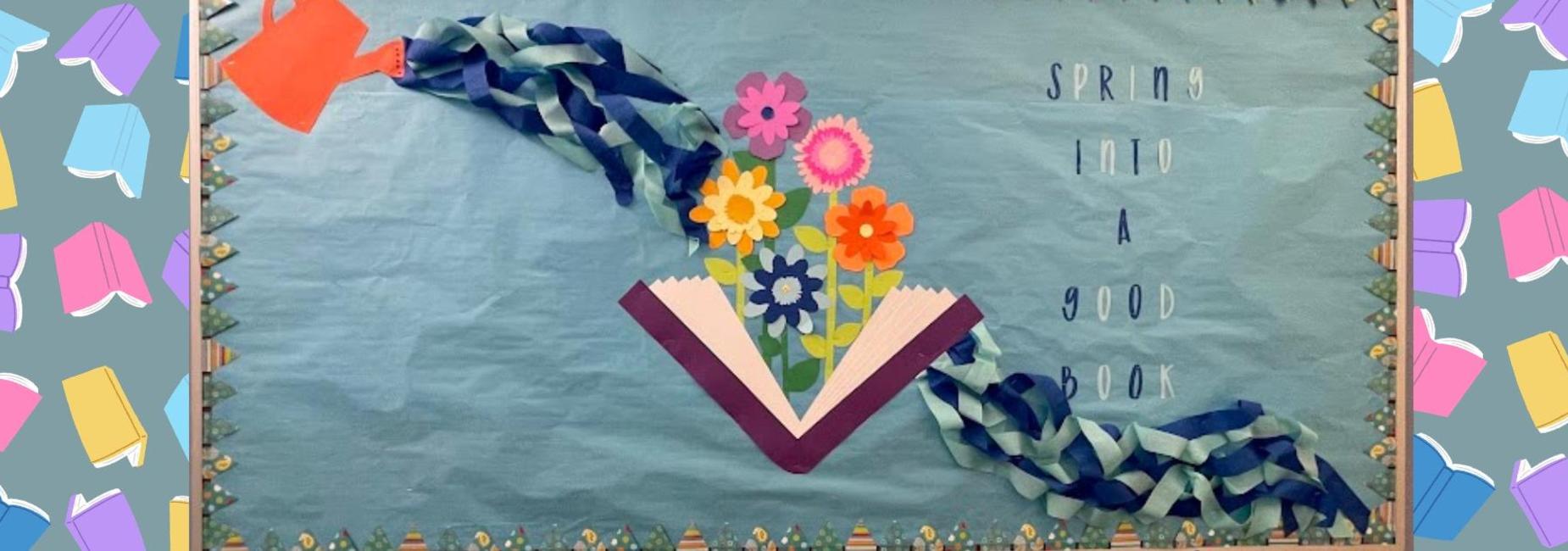 Colorful spring-themed bulletin board with flowers and a book.