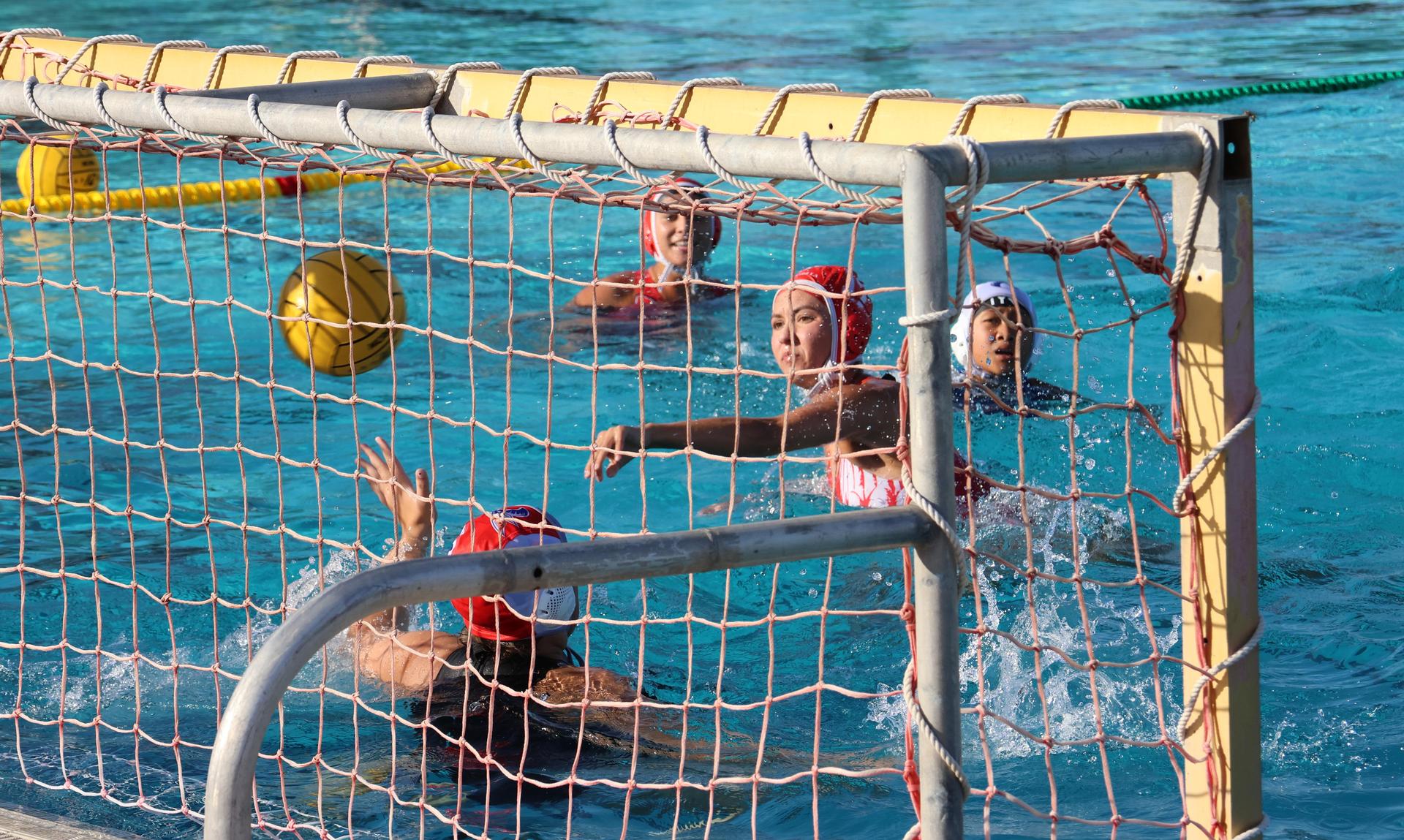 girls playing water polo against Sanger West