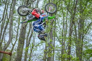 rider doing a backflip on a dirtbike