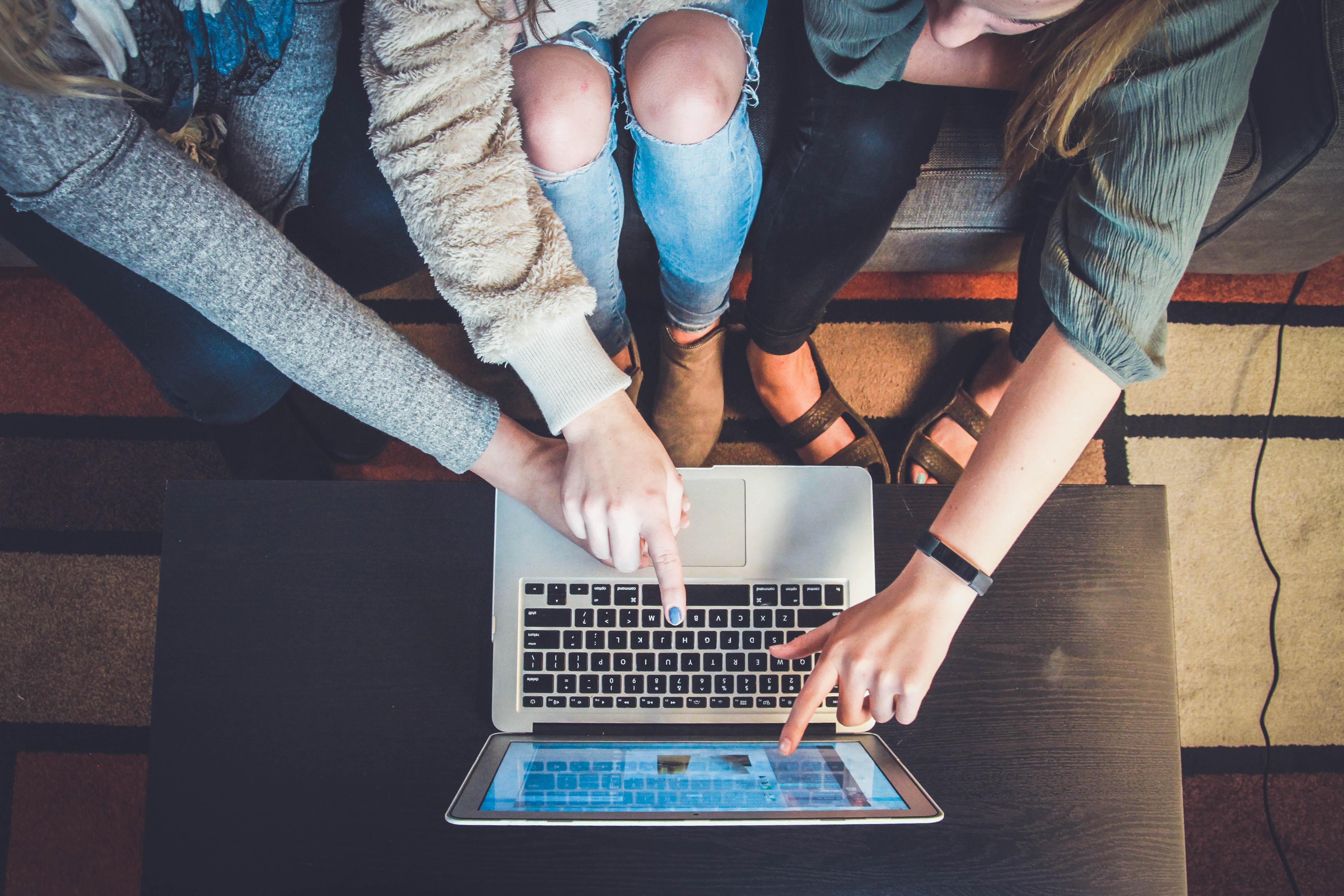 students using a laptop