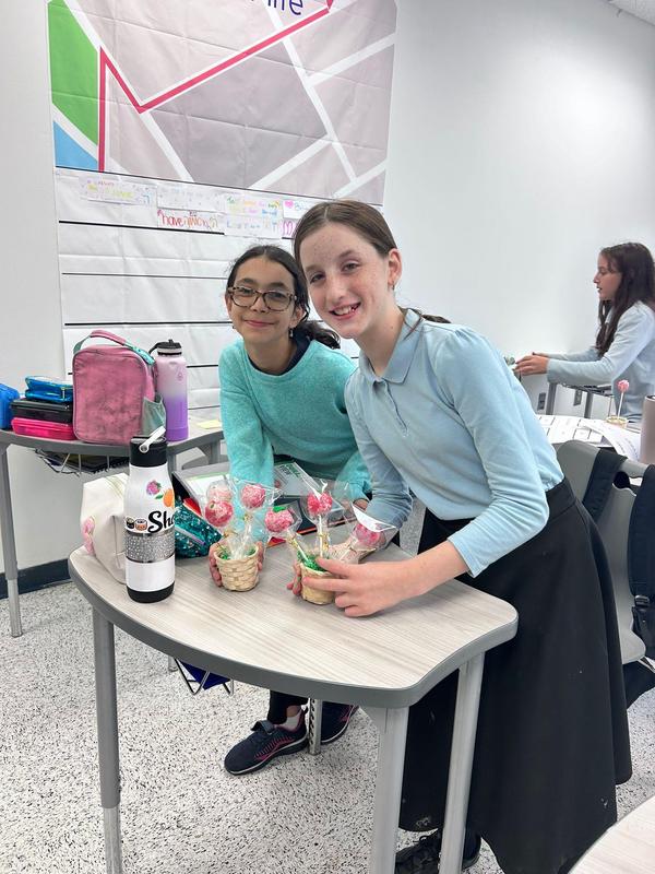 Two students decorating their cake pops