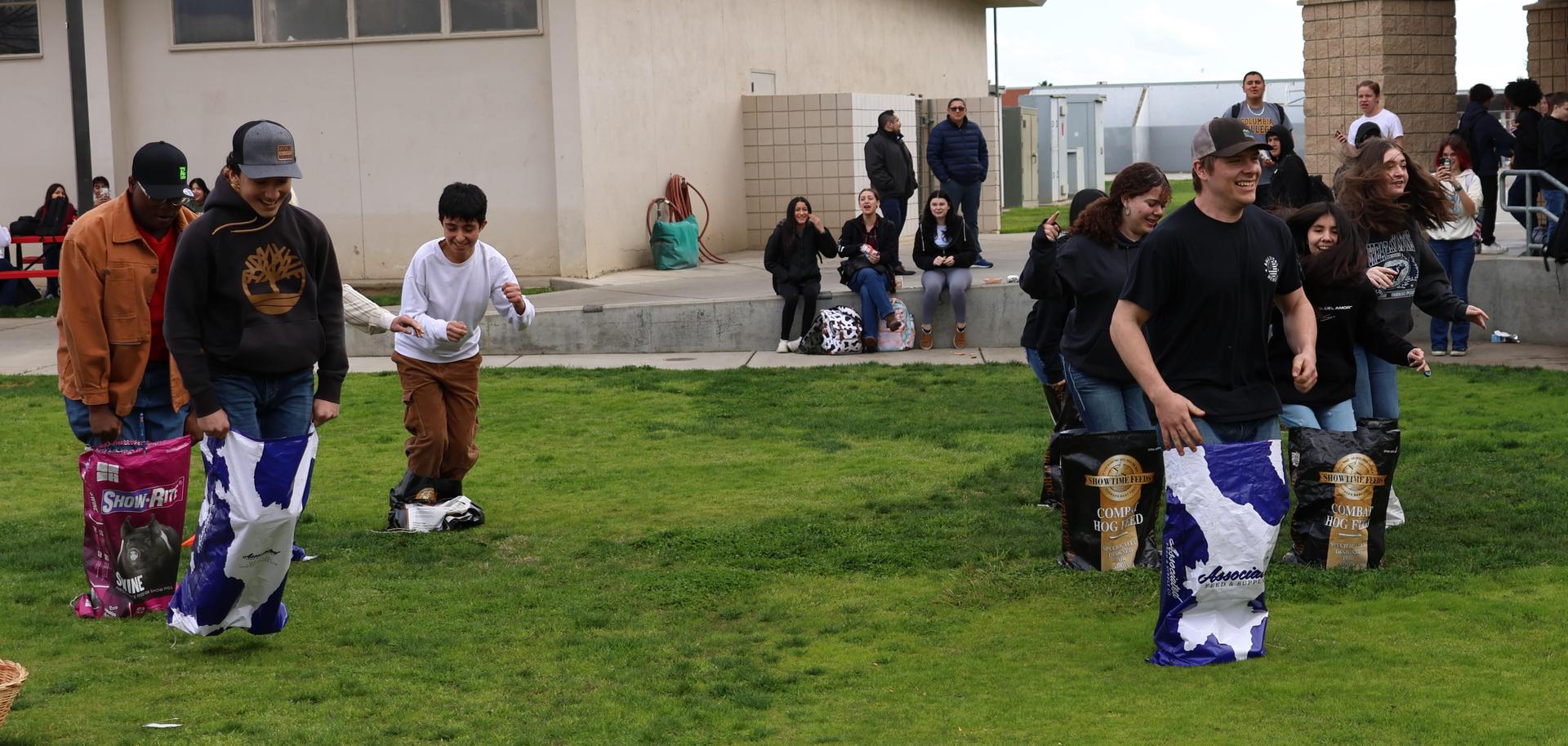students and staff enjoying the feed bag relay