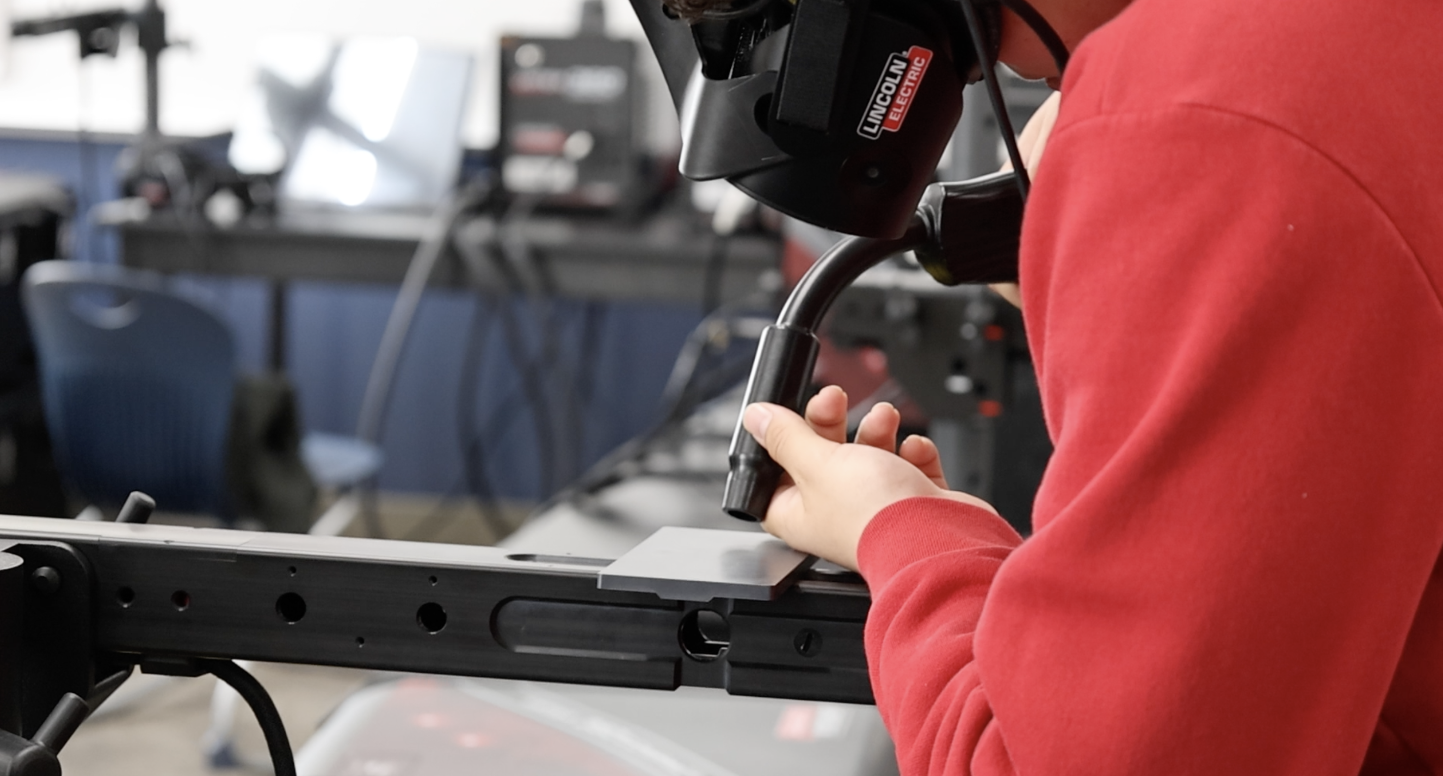 Student working on welding in his classroom