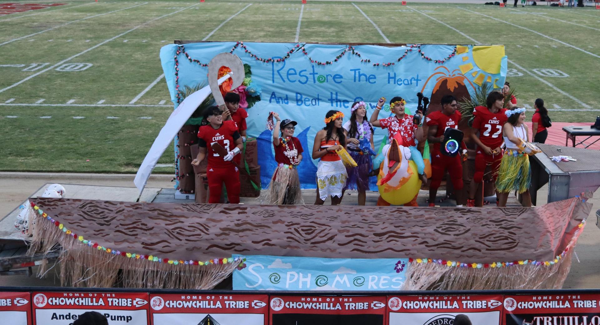 students, staff, and community members enjoying Friday night at the football game