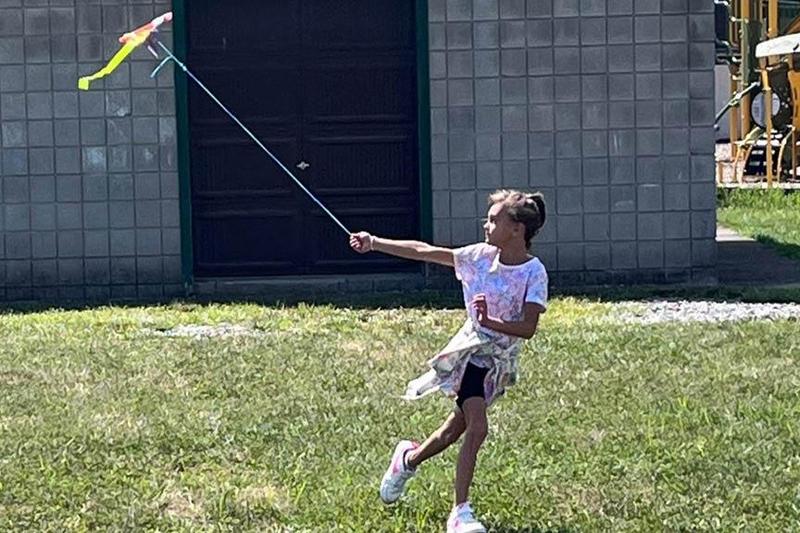 Talula Jennings flies her group’s kite outside the school