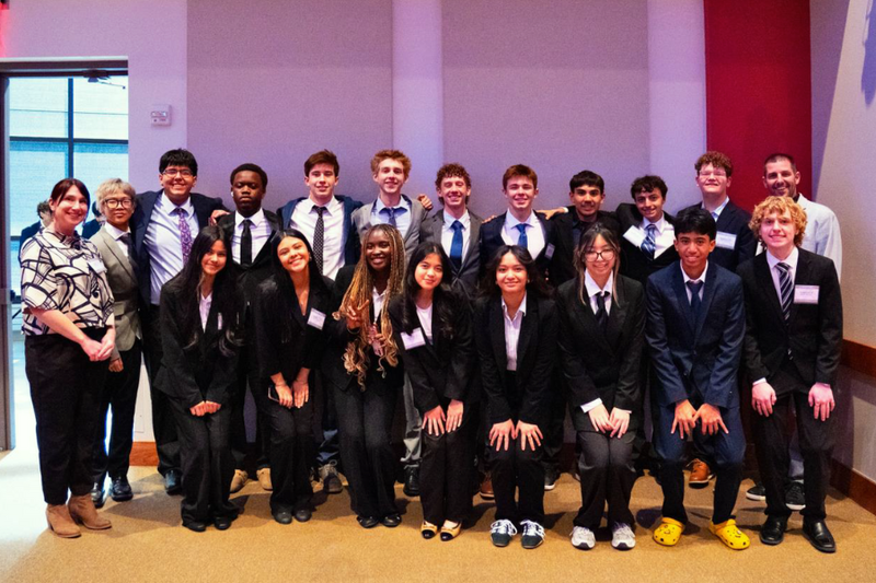 Group photo of DECA students after district competition.