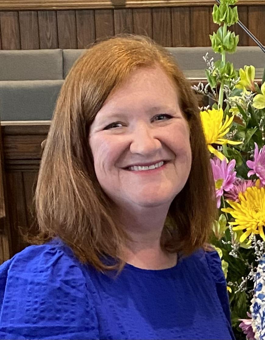 Red headed lady in blue dress