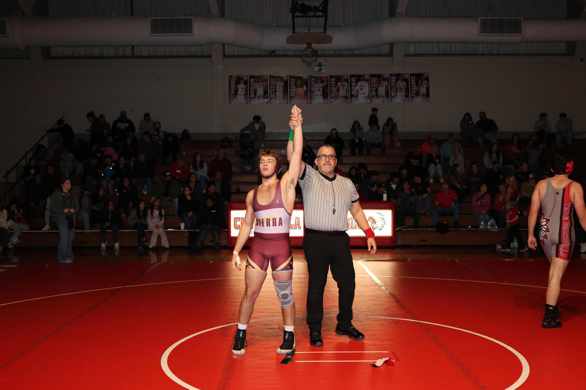 Wrestling winners with hands up 36