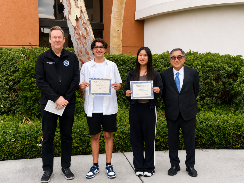 Dr. Ben Wolf and Board Member C. Joseph Chang with winners.