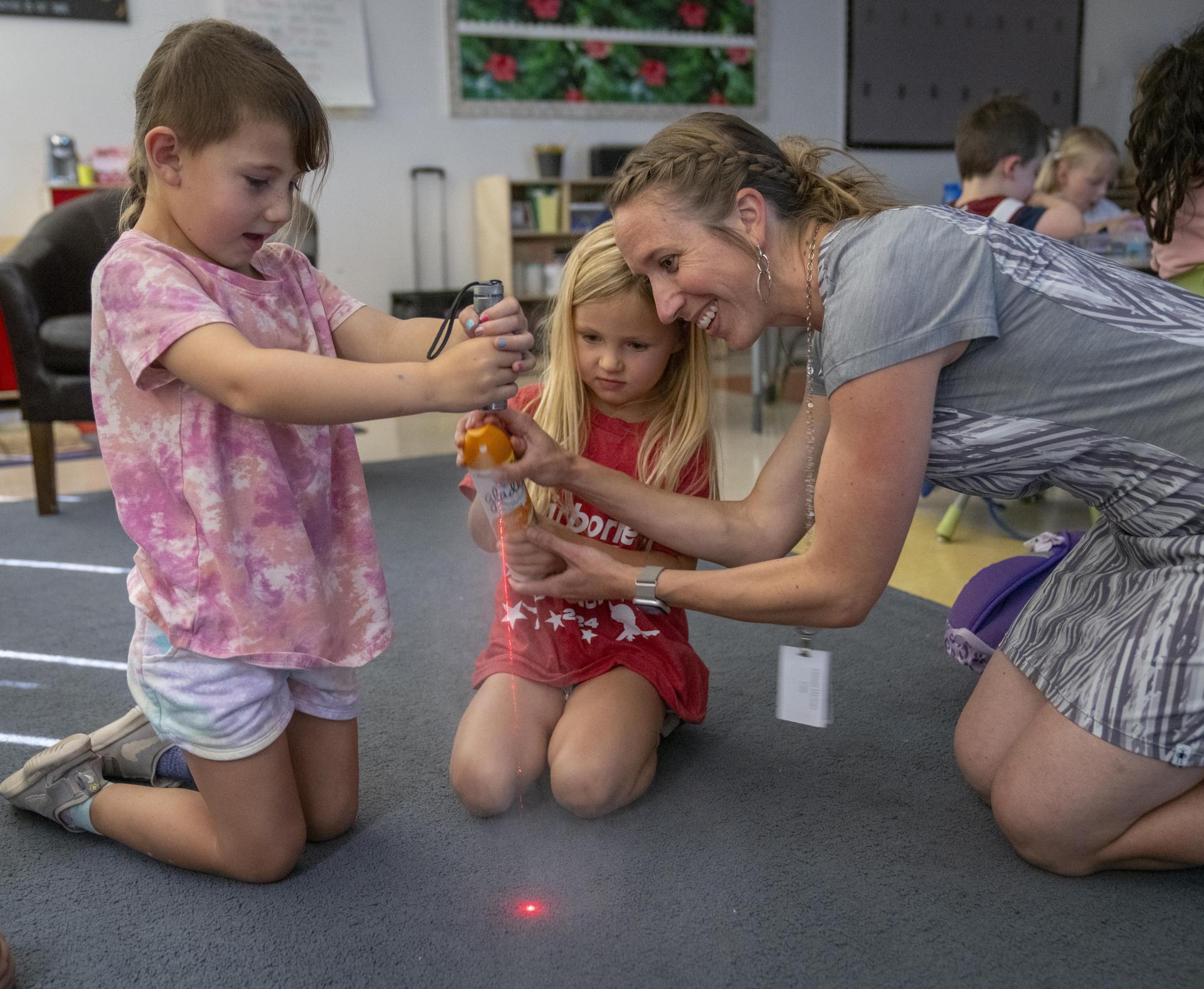 teacher working with students in a classroom