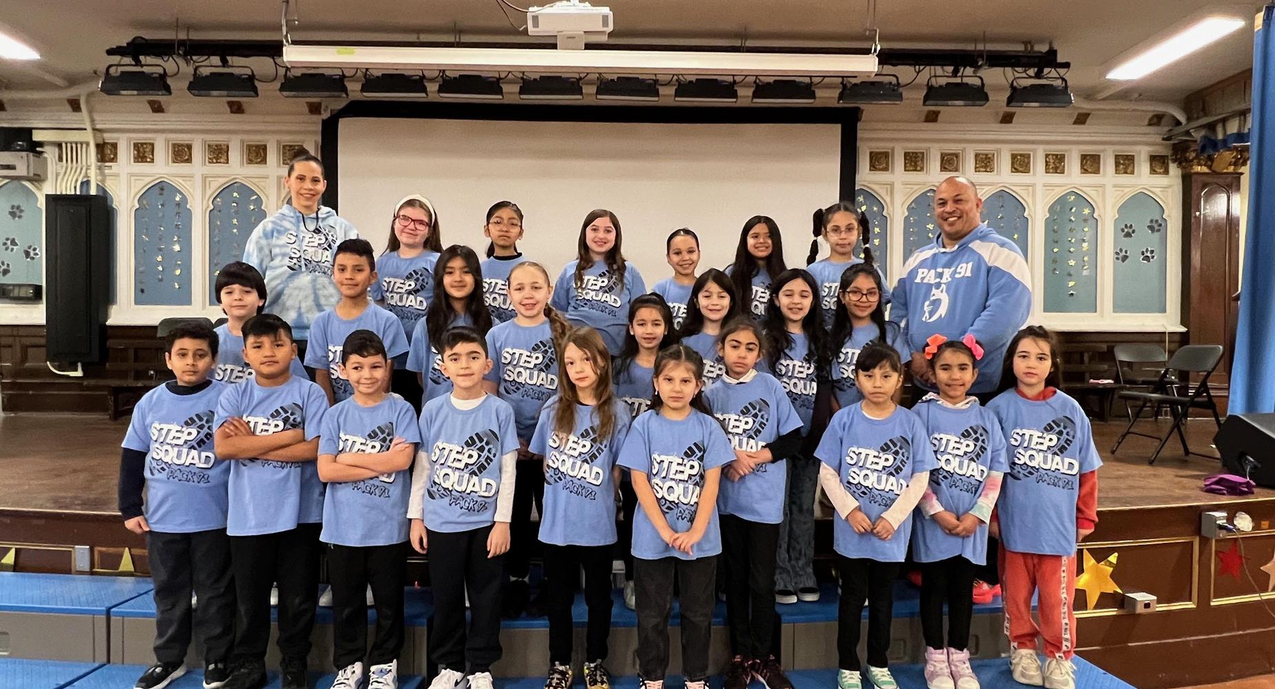 Picture of step squad with coaches in three rows