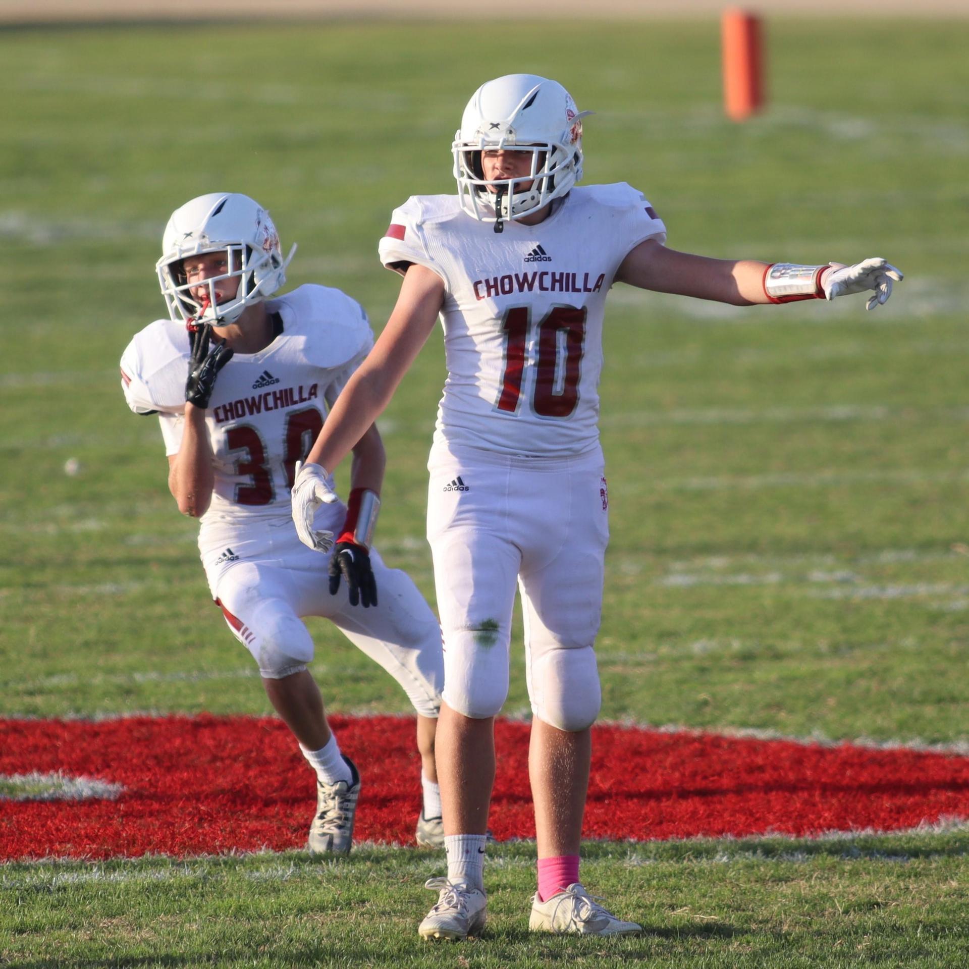 Junior Varsity football players in action against Caruthers