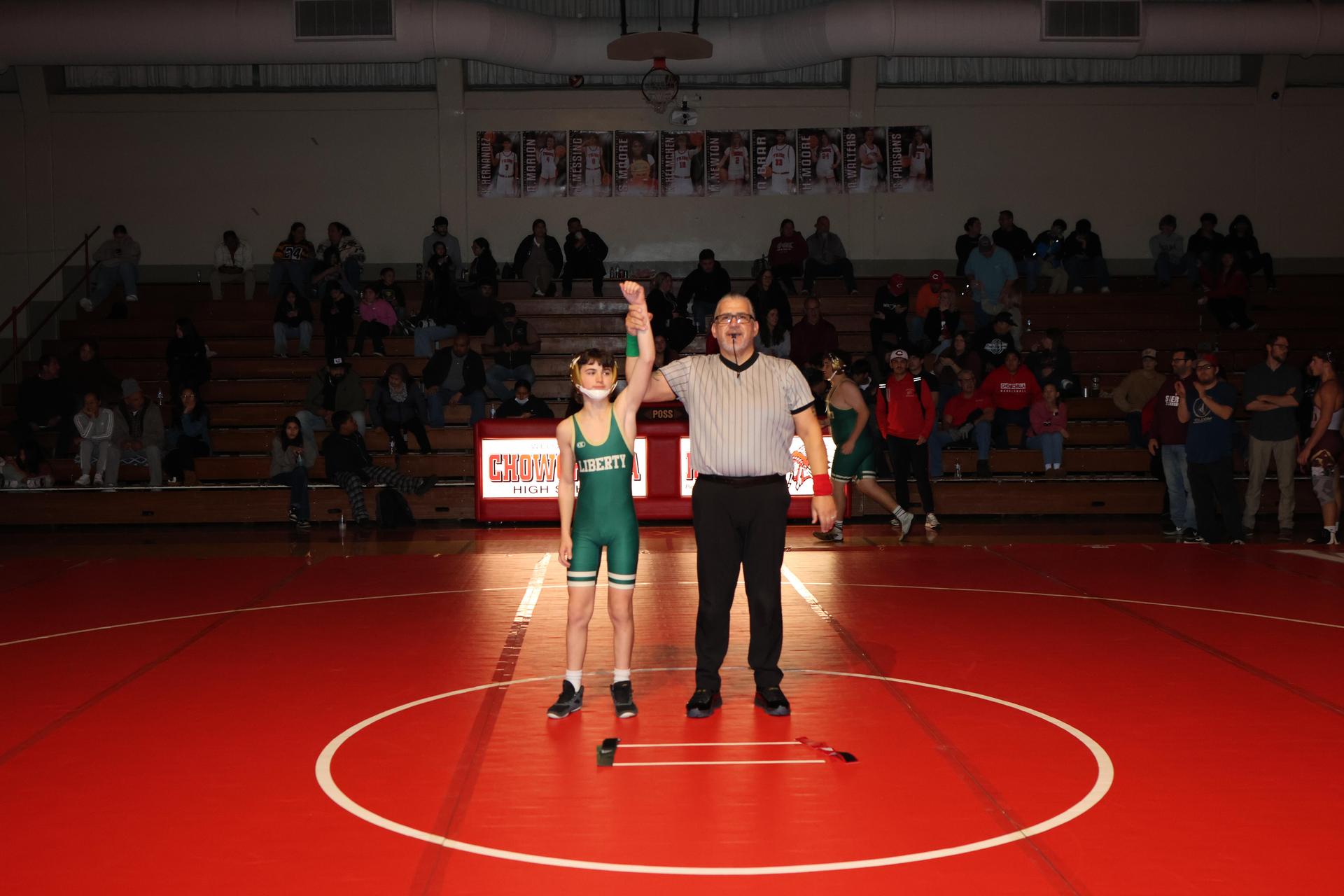 Wrestling winners with hands up 79