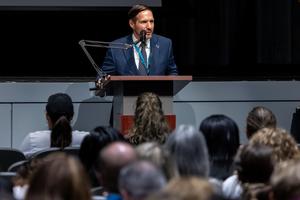 Dr. Eddie Willson speaks to the staff