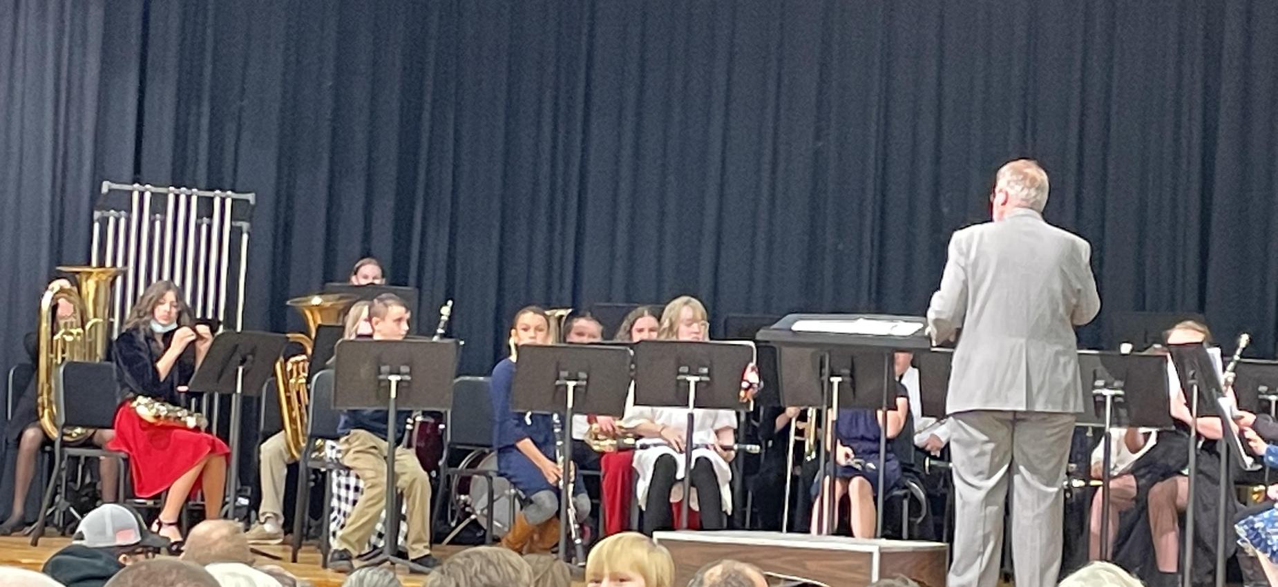 A band plays on a stage.