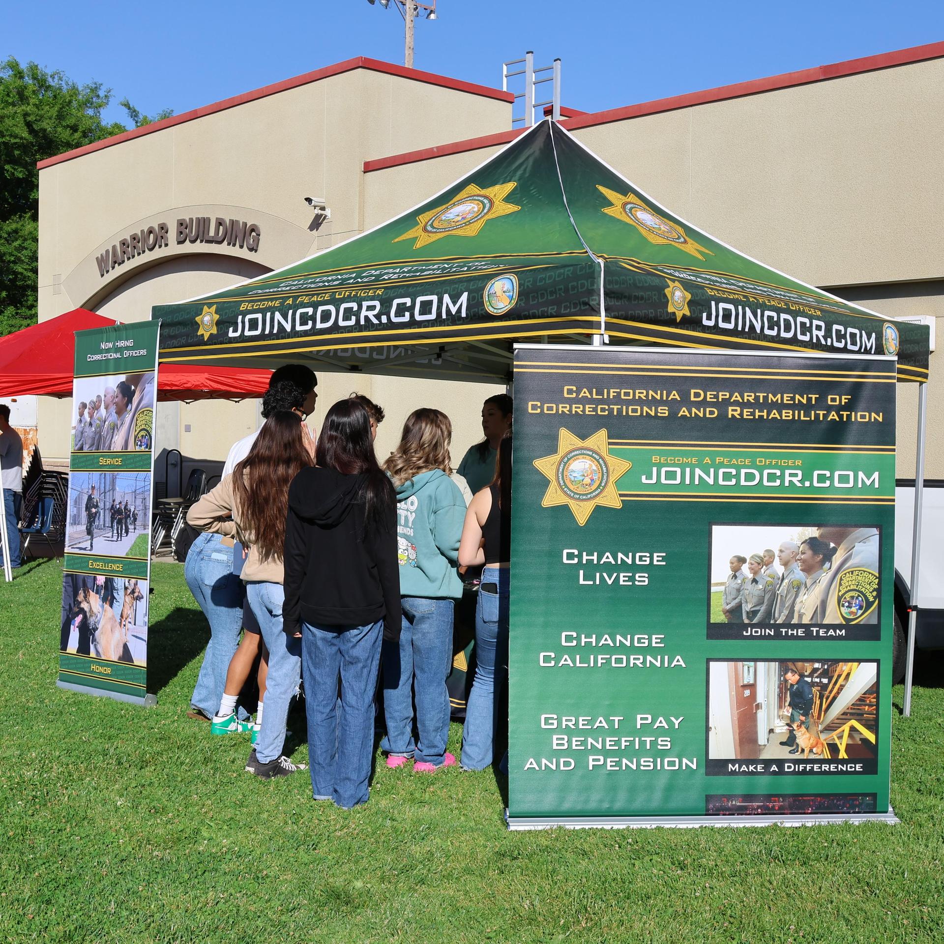 Correctional officers speaking to students