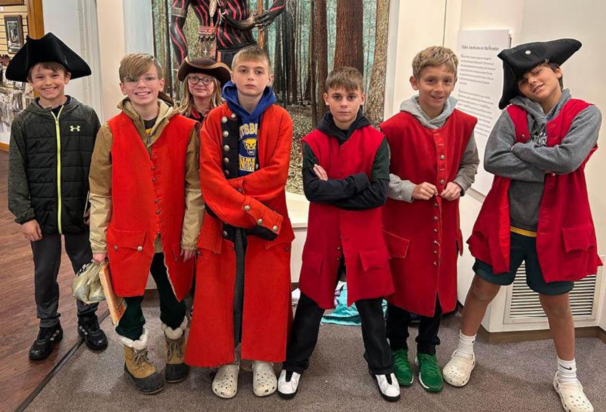 Sunrise Elementary 5th-graders try on uniforms at Bushy Run Battlefield