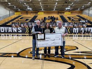Mrs. Wilkins accepting her Teacher of the Month award with Dr. Teal and Mr. Jones