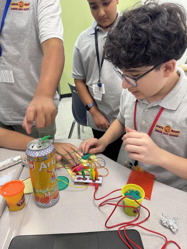 students using circuits with everyday objects