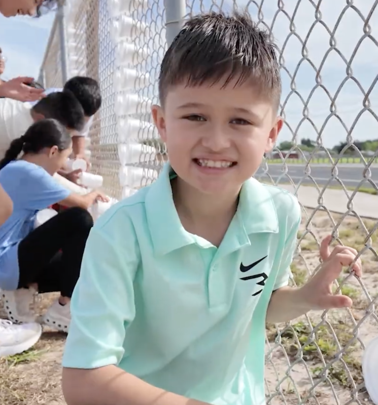 Cano-Gonzalez Student Decorating a Fence